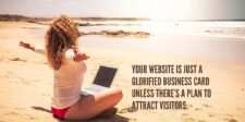 A woman sitting on a beach with a laptop, representing the freedom and success achievable with a well-optimized site. Learn how to get traffic to your website.
