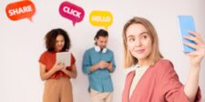 Social media strategy: how to build a plan people respond to Woman taking a selfie while two people behind her use a tablet and smartphone, with social media prompts reading “Share,” “Click,” and “Hello.”