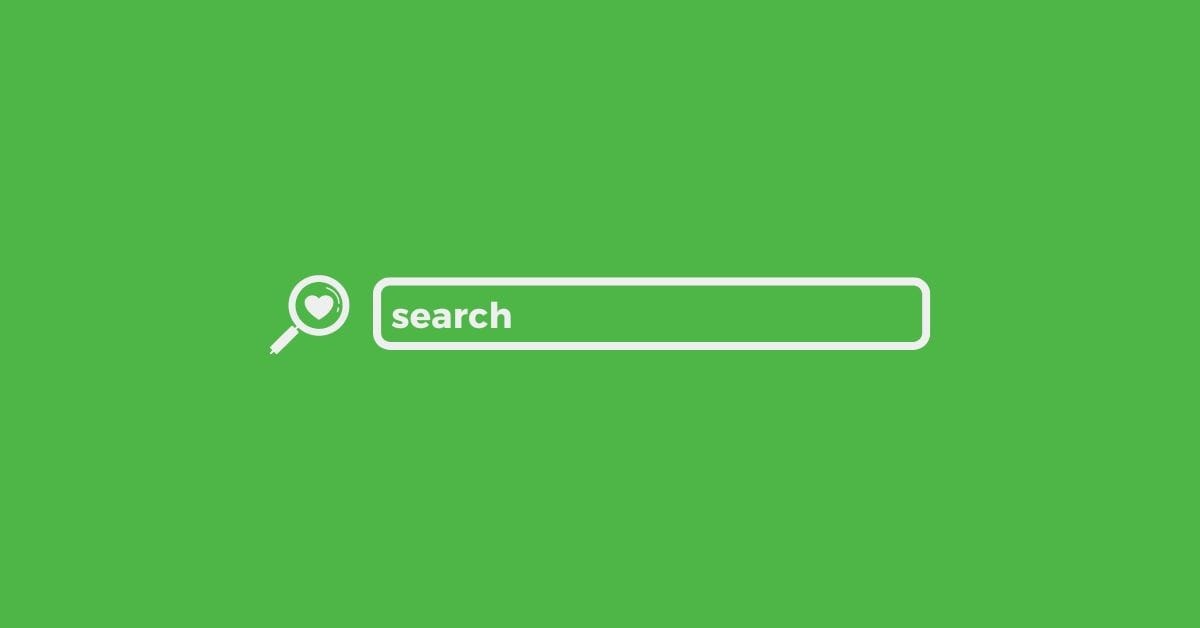An illustration of a search bar on a green background. The search bar contains the word "search" and is accompanied by a magnifying glass icon with a heart in the center, symbolizing a search function that focuses on user preferences or interests.