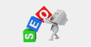 3D figure stacking colorful blocks that spell “SEO.”