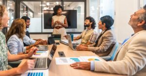 Business team reviewing charts and marketing plans during a strategy meeting, illustrating the four Ps of the marketing mix.