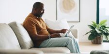 How to write web copy without copywriting experience Small-business owner working on website copy on a laptop from home.