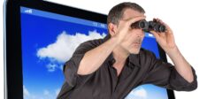 A man with binoculars sticking his head out of a screen - Helpful Content Update