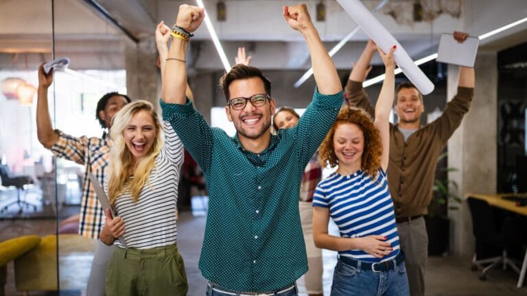 A group of co-workers enjoying themselves, simplifying the importance of employee wellbeing