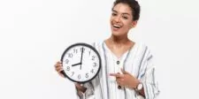 A woman holding a clock, symbolizing time as a valuable resource