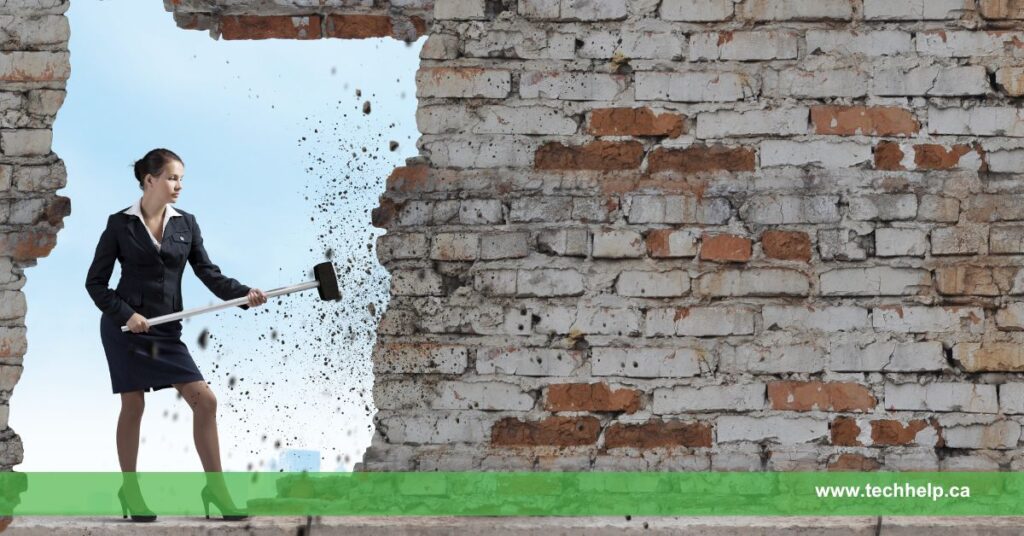 A woman in a business suit uses a sledgehammer to break through a brick wall, symbolizing how to overcome adversity by breaking down barriers and challenges.