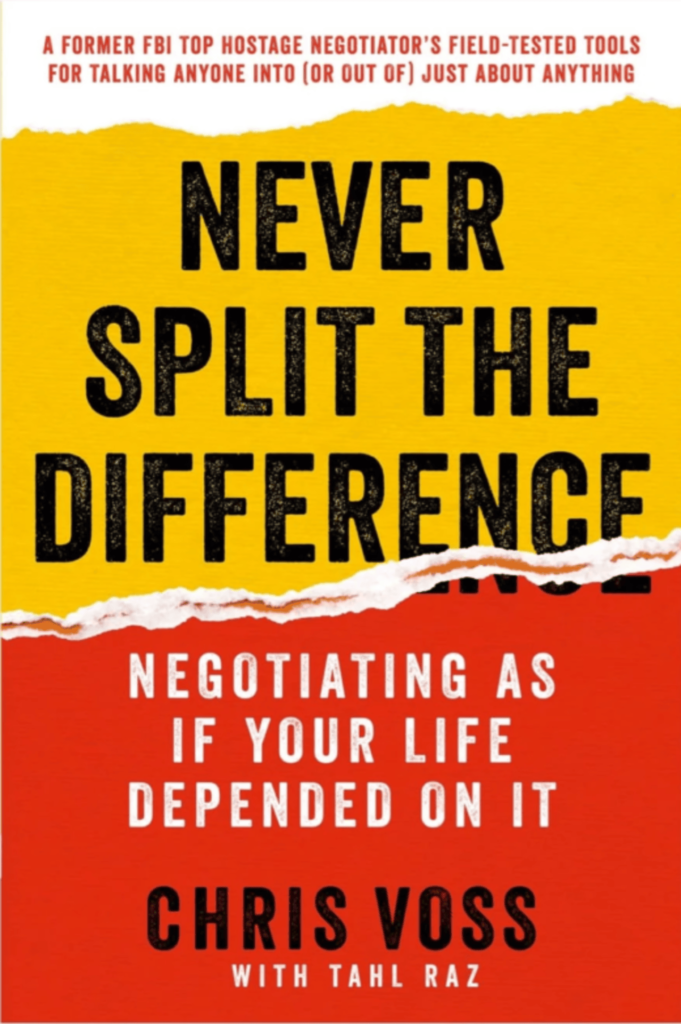 Cover of 'Never Split the Difference' by Chris Voss with Tahl Raz, featuring a bold black title on a yellow and red background with a torn paper design.