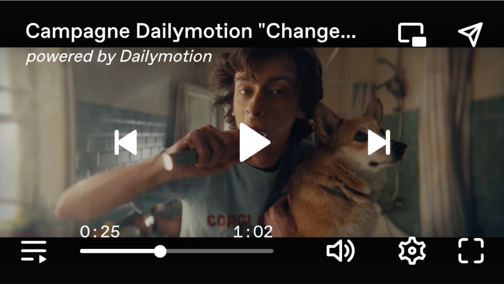 Video player interface of a "Campagne Dailymotion" ad featuring a person brushing their teeth while holding a dog. The video is powered by Dailymotion, showing a progress bar and playback controls.