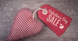 Red fabric heart with Valentine's Day Sale tags.