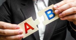 Person holding two puzzle pieces labeled A and B, symbolizing rebranding or collaboration.