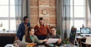 Team collaborating on a project in a modern office.