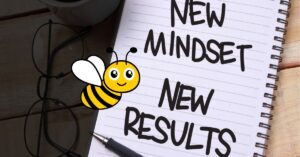 A notebook with the words "New Mindset, New Results" written on it, symbolizing the power of shifting to a mentality of abundance. A cute cartoon bee adds a playful touch, reinforcing the idea that a new perspective leads to new opportunities.