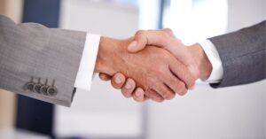 Close-up of a handshake, symbolizing a successful business partnership.