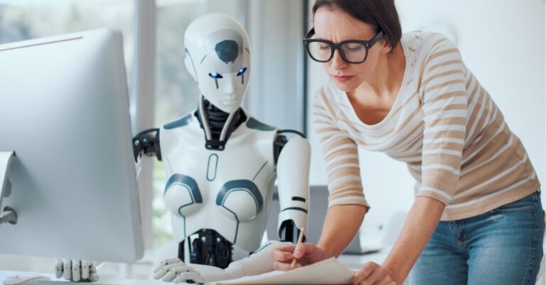Person collaborating with a robot, reviewing notes.