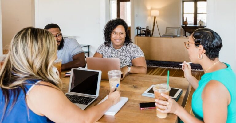 Team reviewing startup funding trends. Text: "Global Startup Funding Trends! Critical Insights Reveal New Market Dynamics."