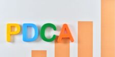 PDCA Cycle: A Proven Strategy for Continuous Improvement Colorful letters "PDCA" with a bar graph in the background.