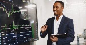 Business team having a focused discussion. Text: "Enhance Your Team's Collaboration Skills!"