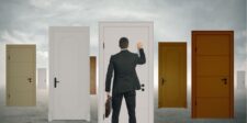 Examples of Elevator Pitch to Land More Opportunities Man in a suit knocking on one of many doors, symbolizing opportunities and choices.
