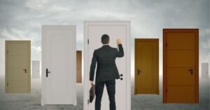 Man in a suit knocking on one of many doors, symbolizing opportunities and choices.