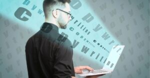Man with laptop surrounded by floating words "Copywriting."