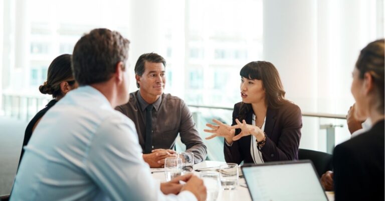 Professionals engaged in a dynamic team meeting.