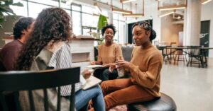 Group of people having a casual meeting in a modern office.
