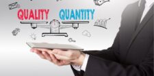 Hands holding a tablet with "Quality vs Quantity" illustrations above.
