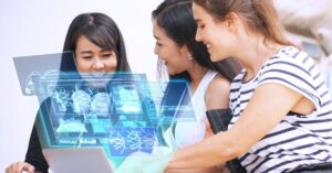 Three women collaborating with futuristic digital data displays.
