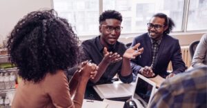 Team meeting in a modern office, discussing strategies.