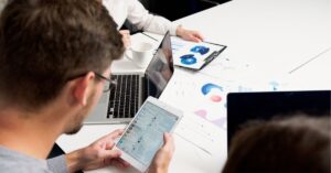 Smartphone with social media icons: A smartphone screen displaying various colorful social media app icons.