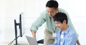 Collaborative Team: Colleagues engaged over a tablet.