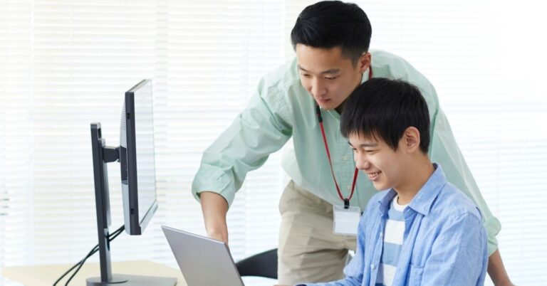 Collaborative Team: Colleagues engaged over a tablet.