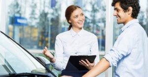 Person using a laptop with social media icons floating around.