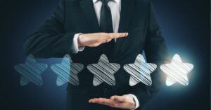 Businessman gesturing toward a five-star rating, emphasizing quality.