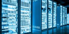 Row of illuminated server racks in a modern data center representing secure data storage.