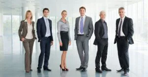 Business professionals standing in a bright modern office