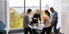 Marketing team meeting in a bright office, representing Adobe’s $1.9 billion Semrush acquisition and the shift toward AI visibility in marketing.