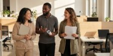 Google Just Turned Search Into an AI Agent — Here's What That Means for Your Business Three professionals walking through a modern office while talking and carrying documents.