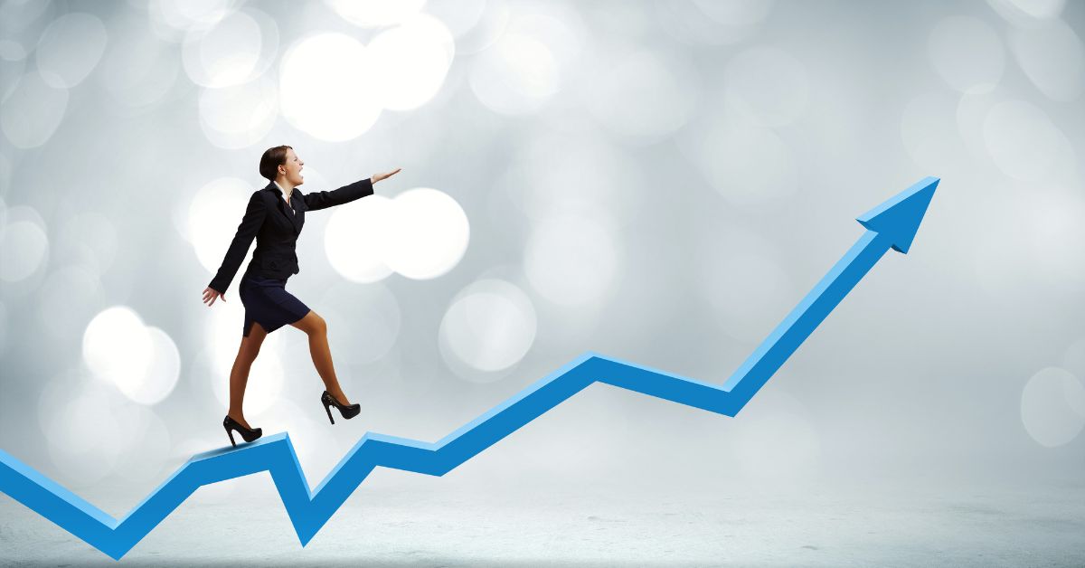 Businesswoman walking along an upward growth arrow