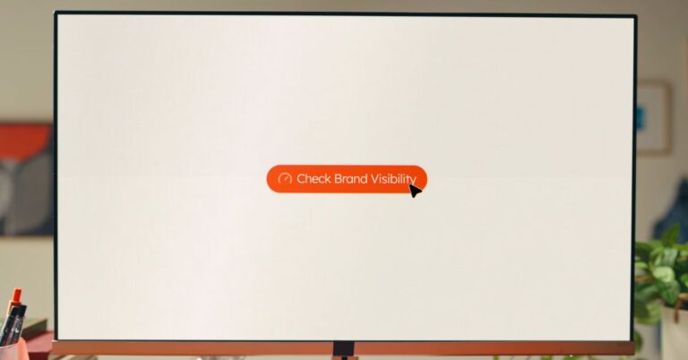 Computer monitor showing a “Check Brand Visibility” button for a HubSpot AEO review.