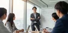 Google's AI generated 70 million ads last quarter — guess who's liable Business team in a modern office discussing a strategy on a whiteboard, representing AI ad planning and accountability.