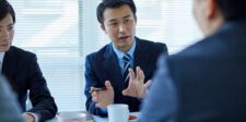 Google Doesn't Want You to Leave Google Anymore Business professionals discussing strategy during an office meeting.