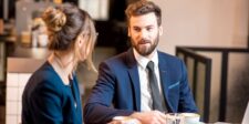 Your loan rate probably isn't changing Wednesday but your forecast should Man and woman in business attire having a conversation at a table with coffee.