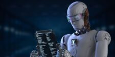 Futuristic humanoid robot reading code on a transparent digital screen.