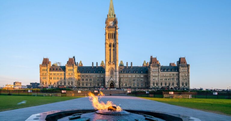 Parliament Hill in Ottawa with the Centennial Flame in the foreground.