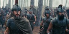 The Odyssey's $1.35 billion playbook: what every business owner can steal from it Armoured warriors moving through a wooded battlefield in a scene from The Odyssey.