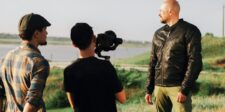 AI cut eight days from The Third Hand, Goodfellas CEO says Film crew shooting an outdoor scene with a camera operator and performer on location.