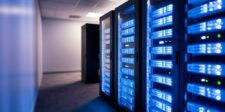 Rows of illuminated server racks inside a modern data centre.
