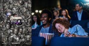 Avengers: Endgame Encore poster beside moviegoers watching a film in a theatre.
