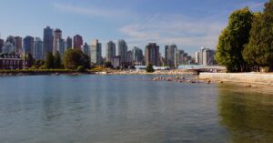 Vancouver skyline viewed across the water from Stanley Park in British Columbia.